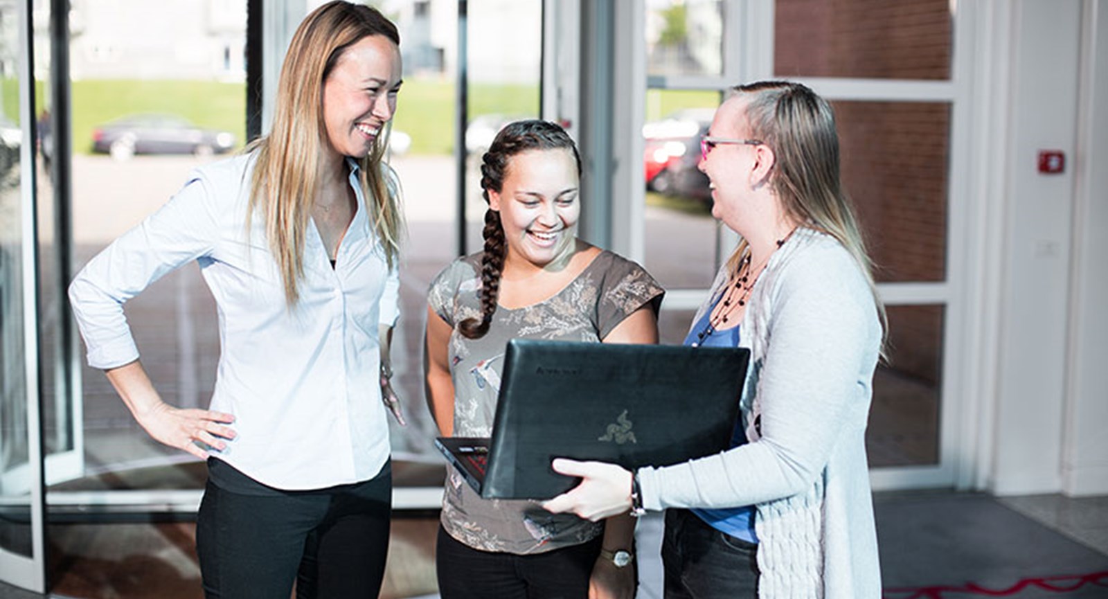 Students meeting with teacher in school