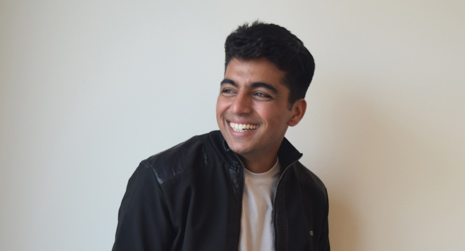 Young student smiling with the white background