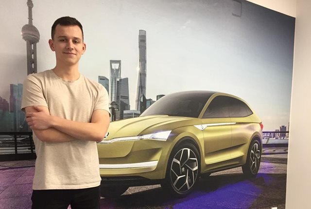 Student standing in the skoda office