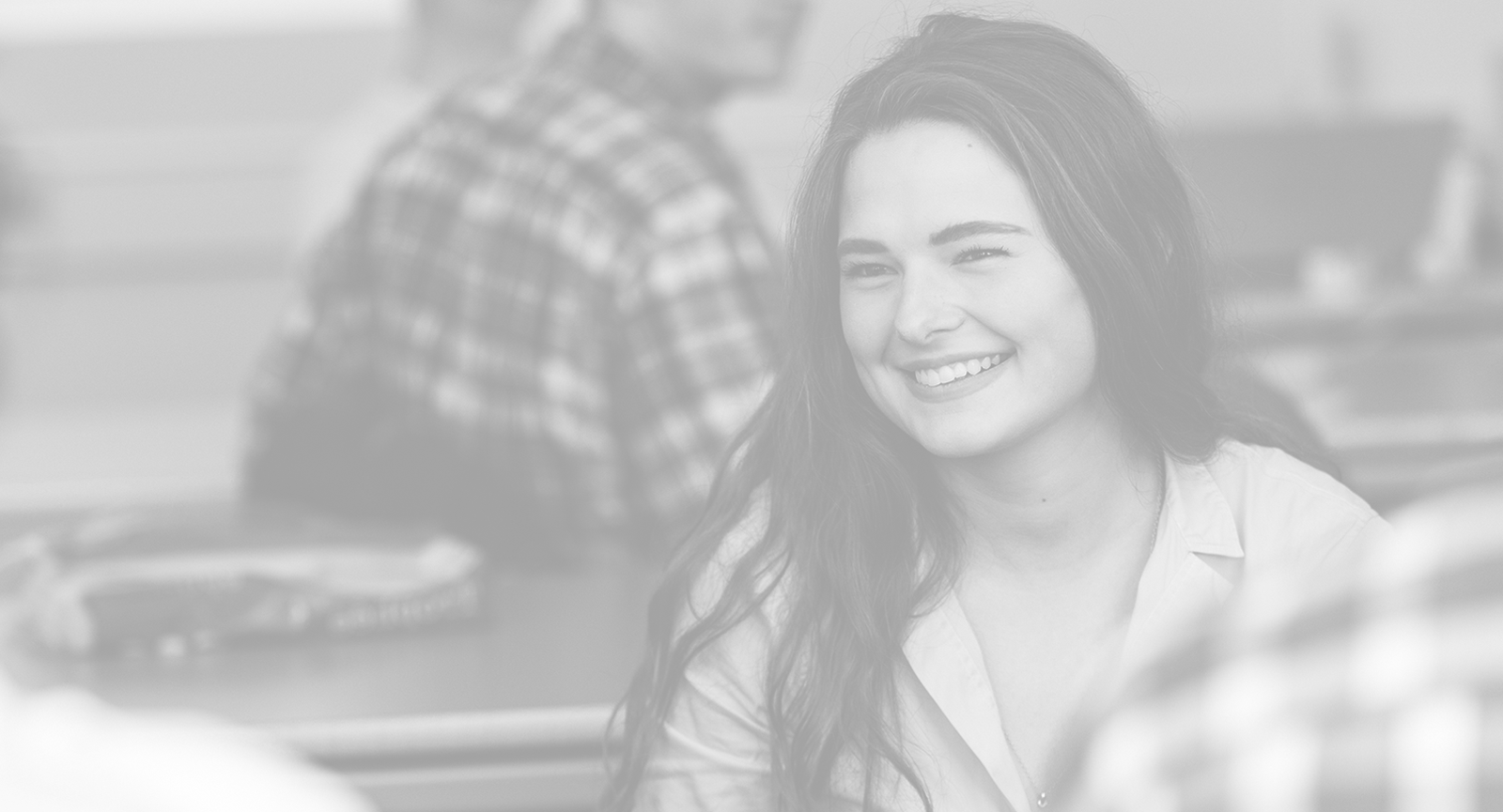 Dark haired student smiling