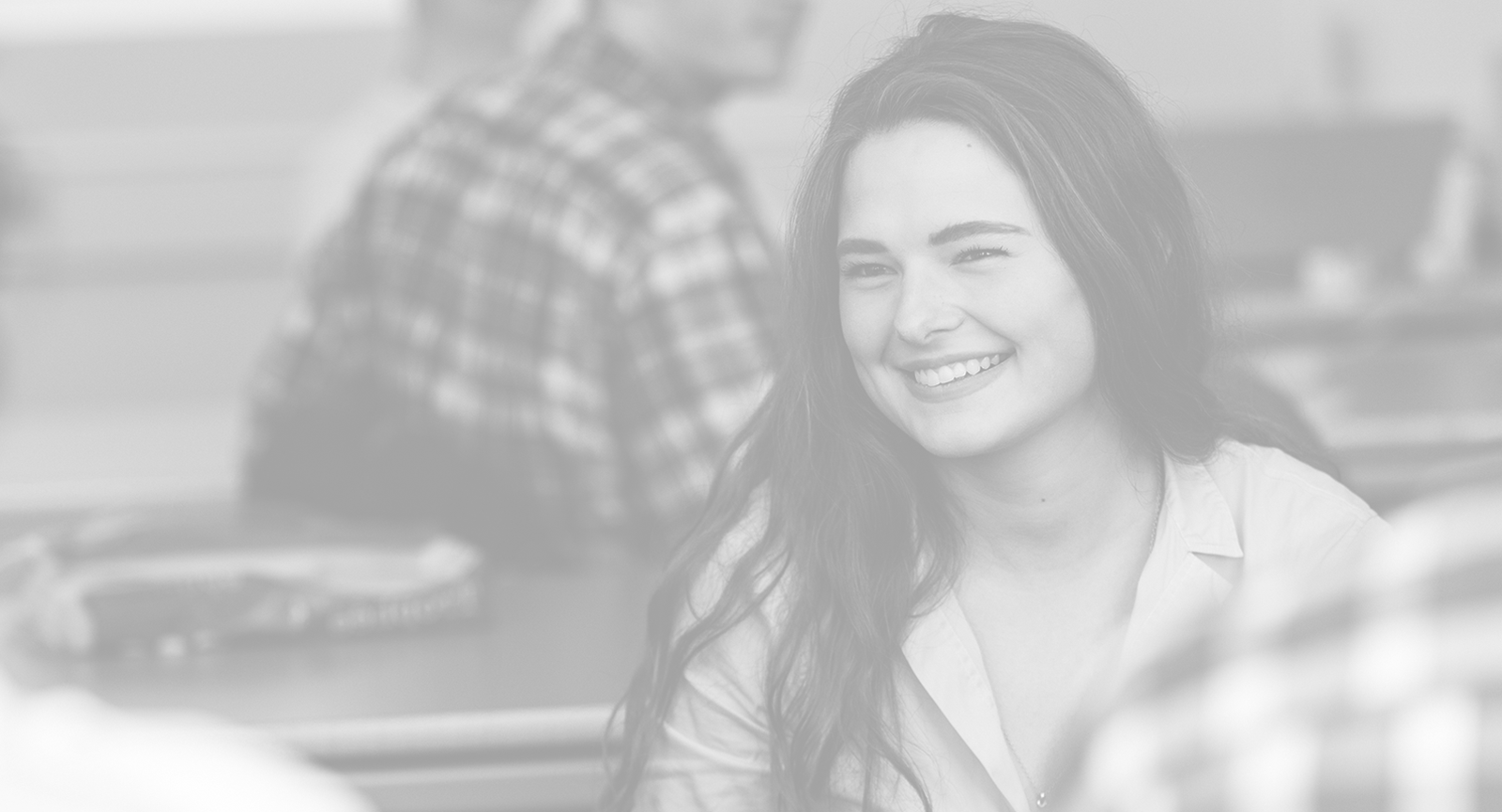 Dark haired student smiling 