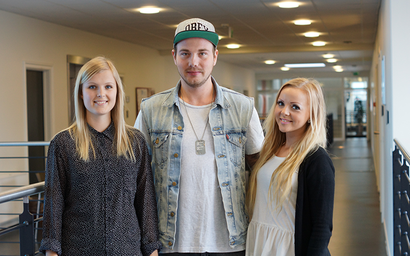 Three students from Randers smiling