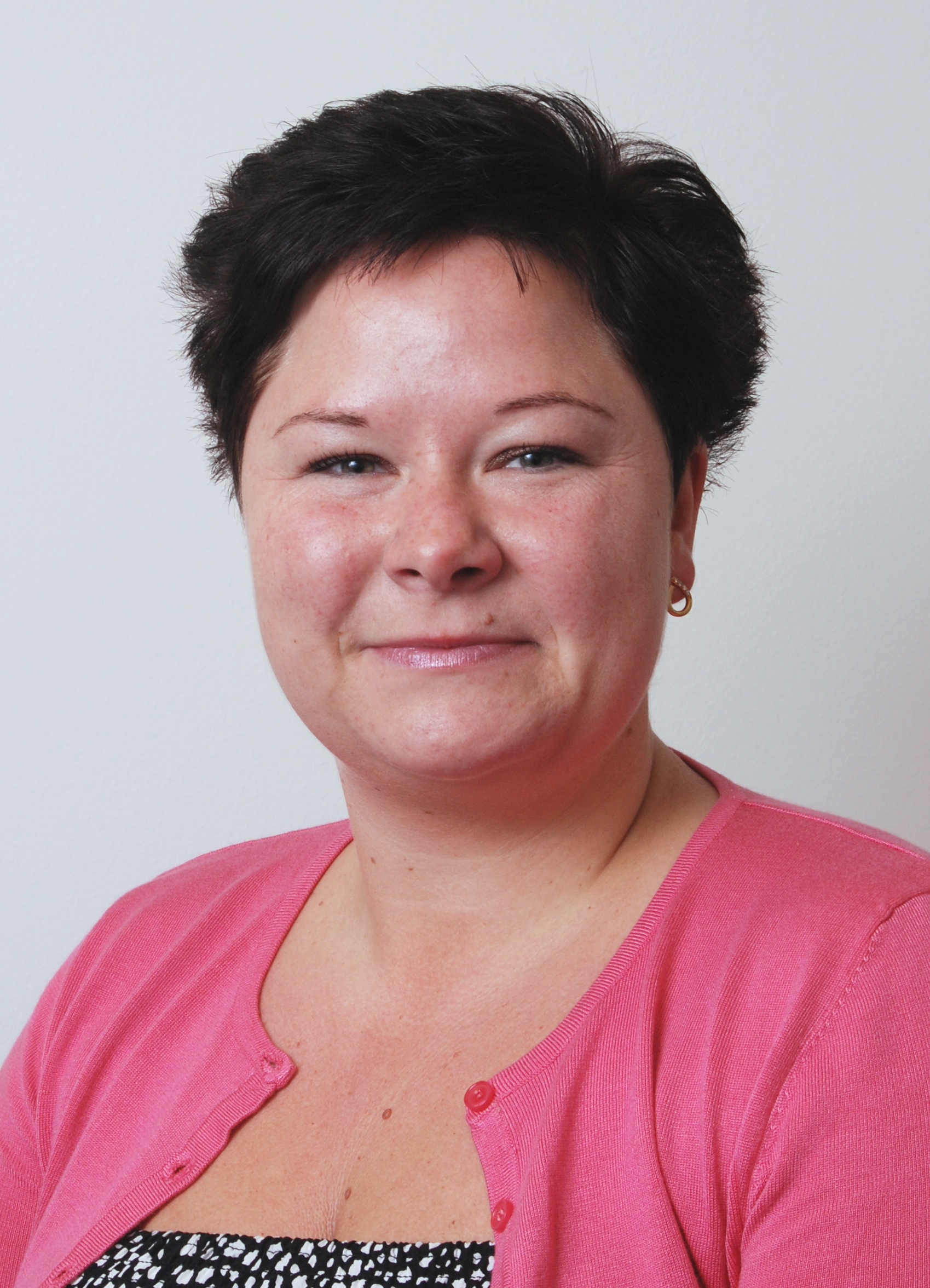 Women in pink t-shirt smiling