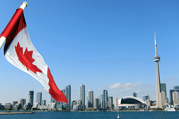 Flag of Canada with the background view for the city