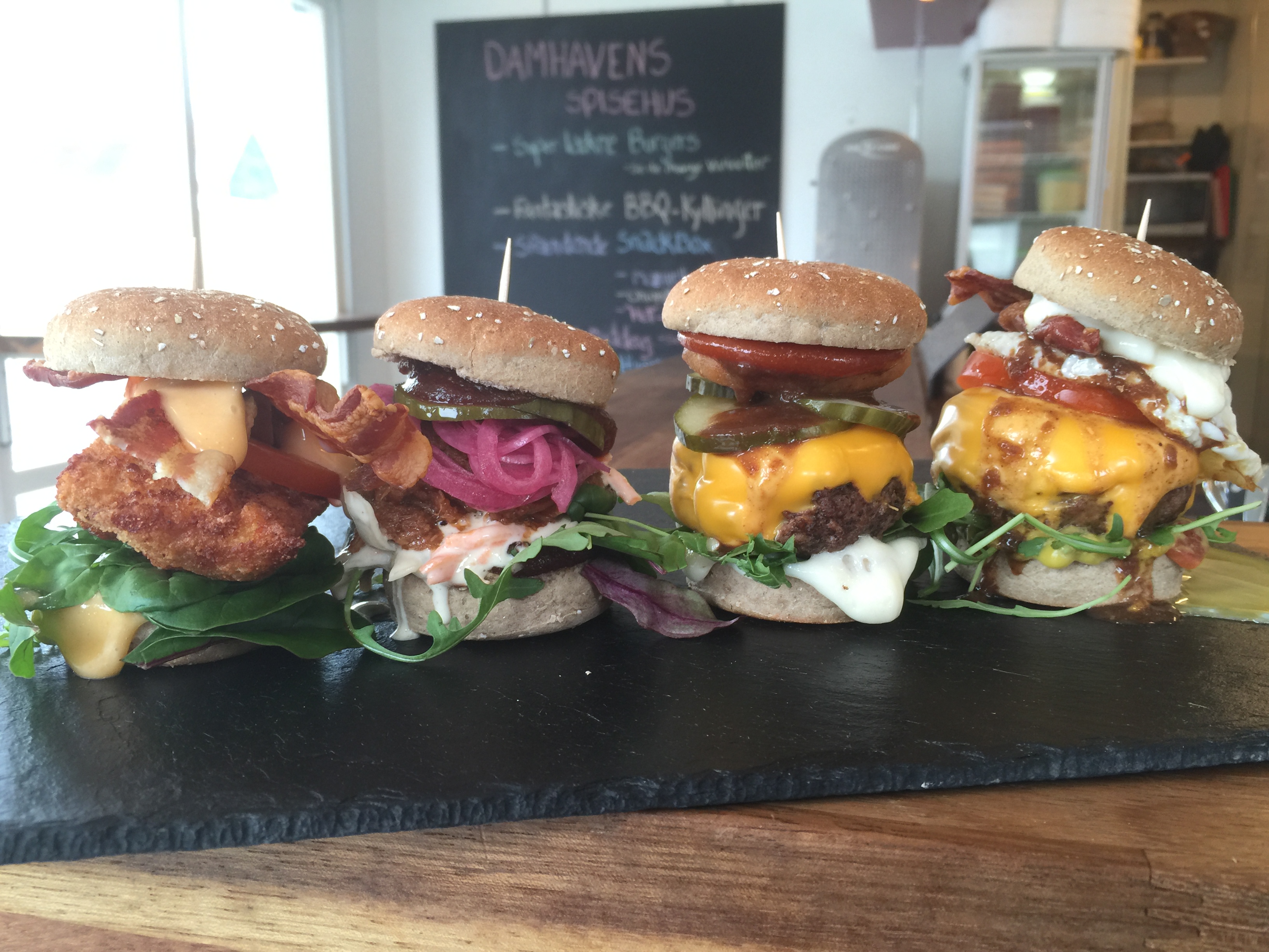 Four burgers with different ingredients 