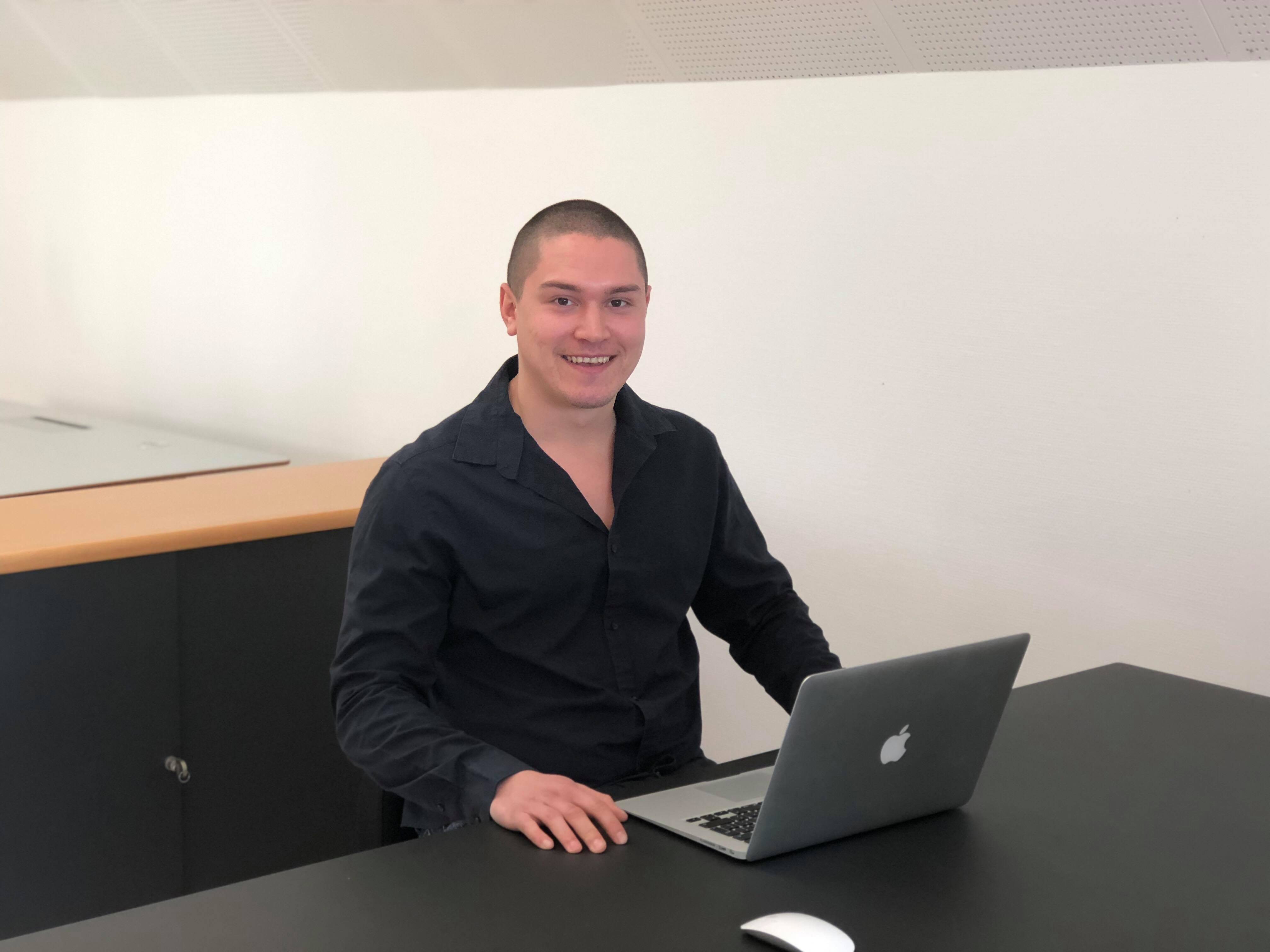 Student siting in the office during internship