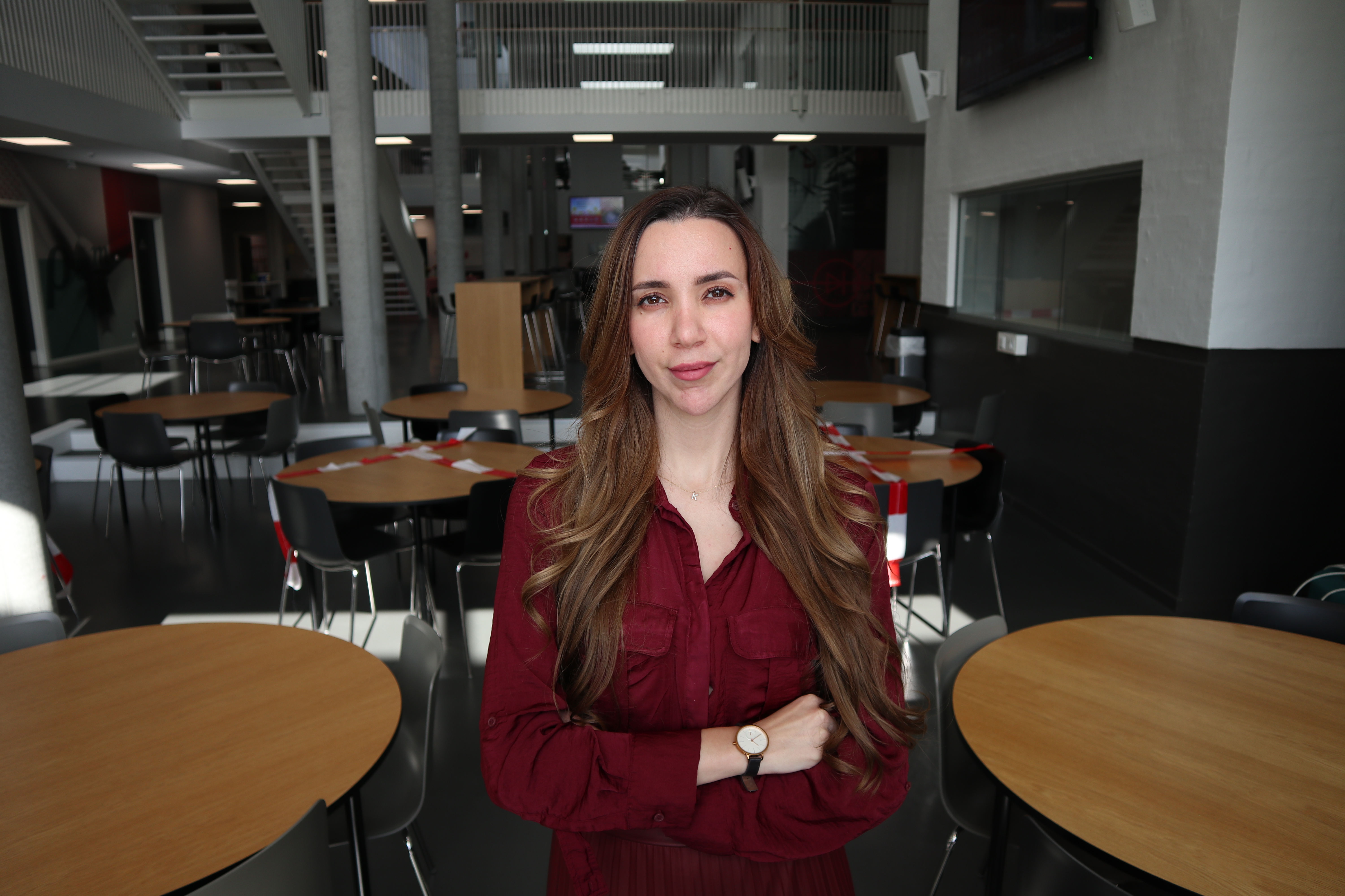 Young women posing to the picture in school canteen